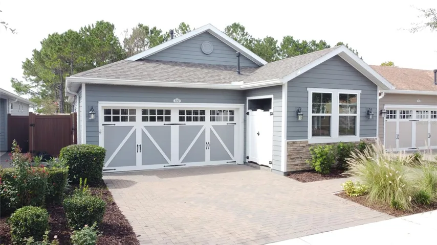 MULTIPLE STAND-OUT FEATURES in your upgraded 2-bedroom, 2-bath courtyard villa with a 2-car garage