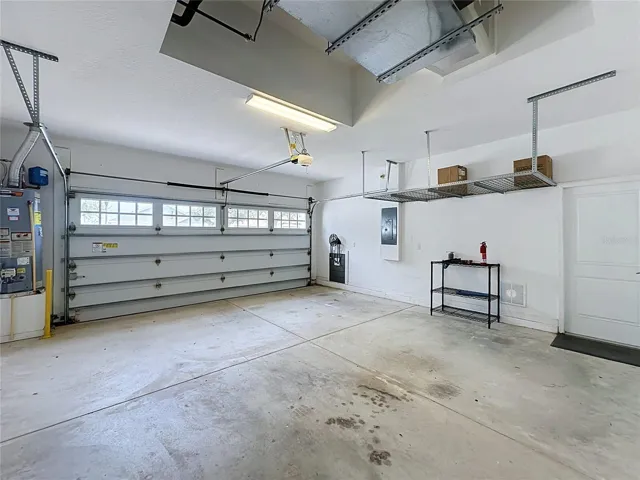 2 CAR GARAGE OFFERS OVERHEAD STORAGE RACKS