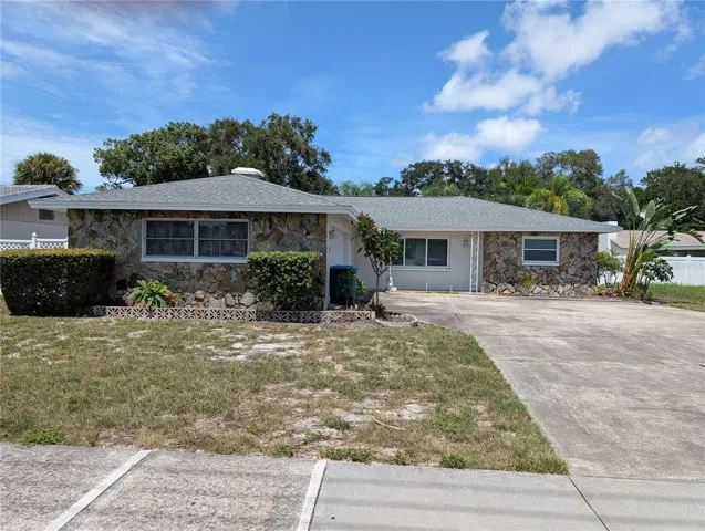 Front exterior with lage parking pad