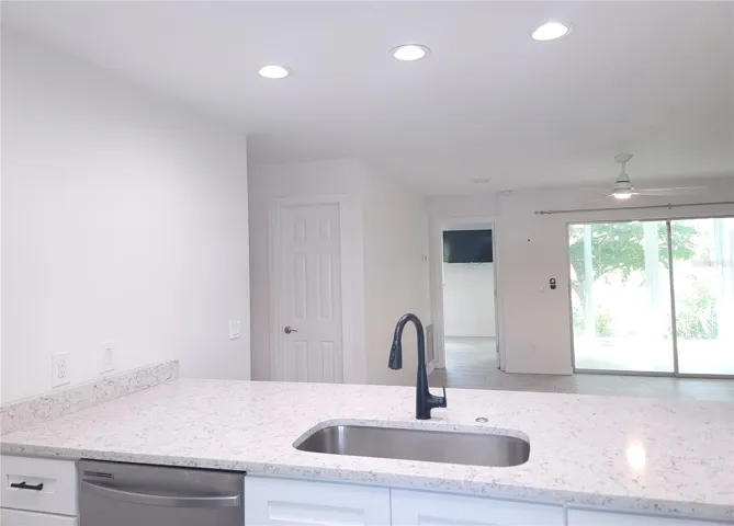 open kitchen to living room and lanai view
