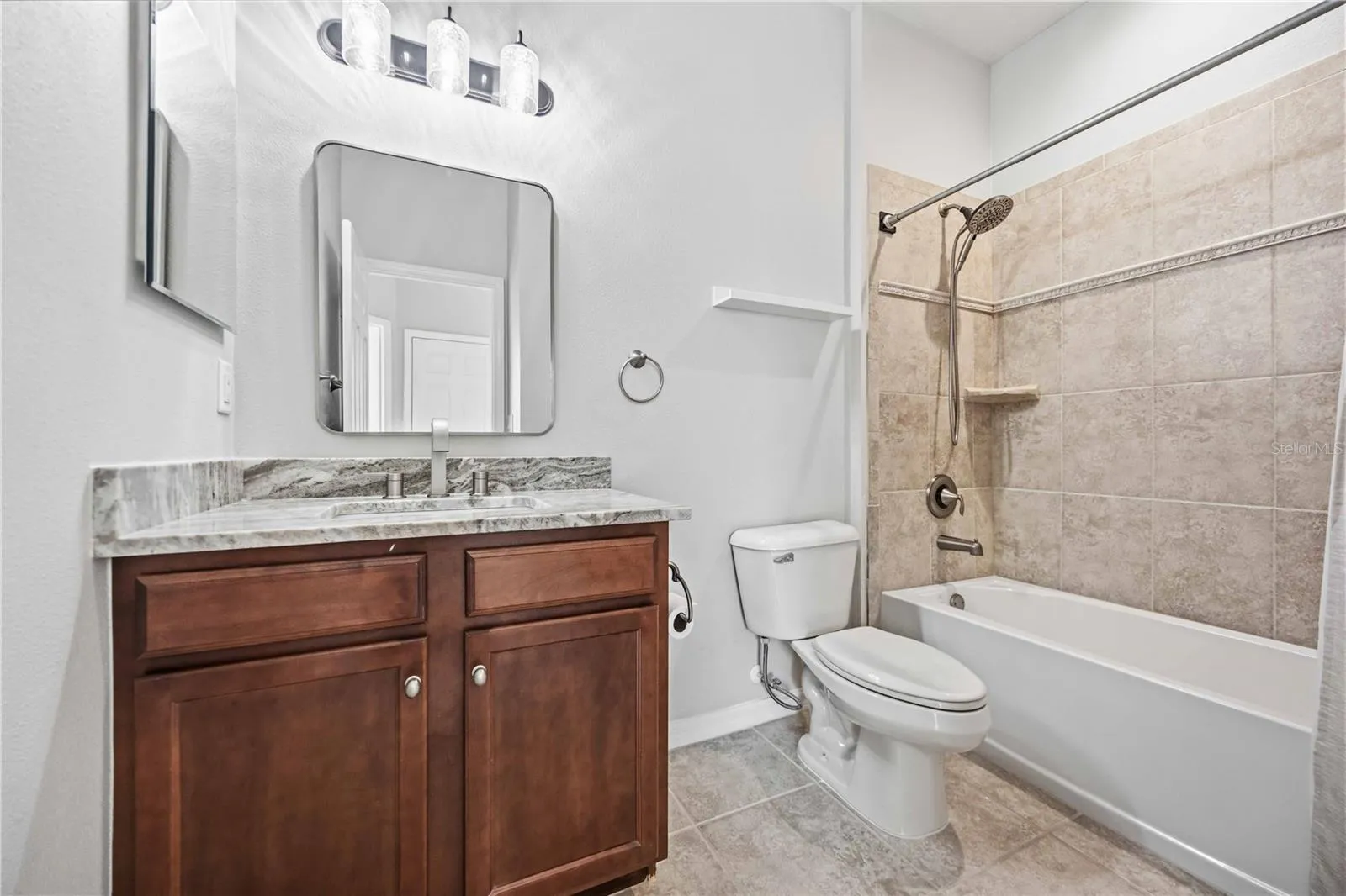 2nd bathroom off the hallway has new countertops and mirrors