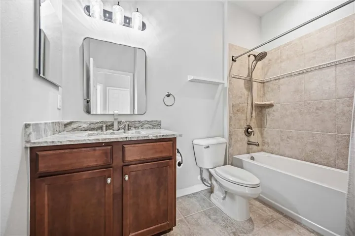 2nd bathroom off the hallway has new countertops and mirrors