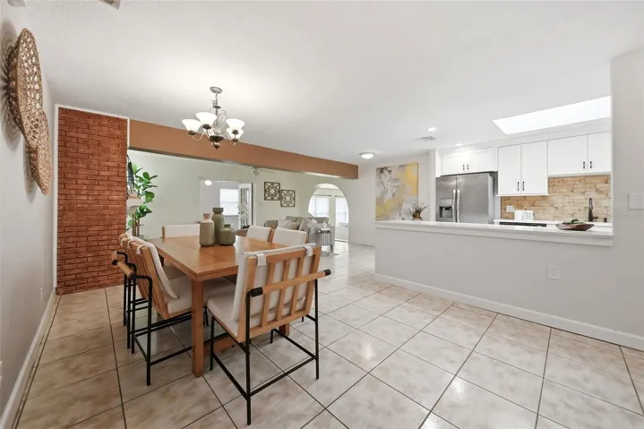 Formal dining room, living room, fireplace.