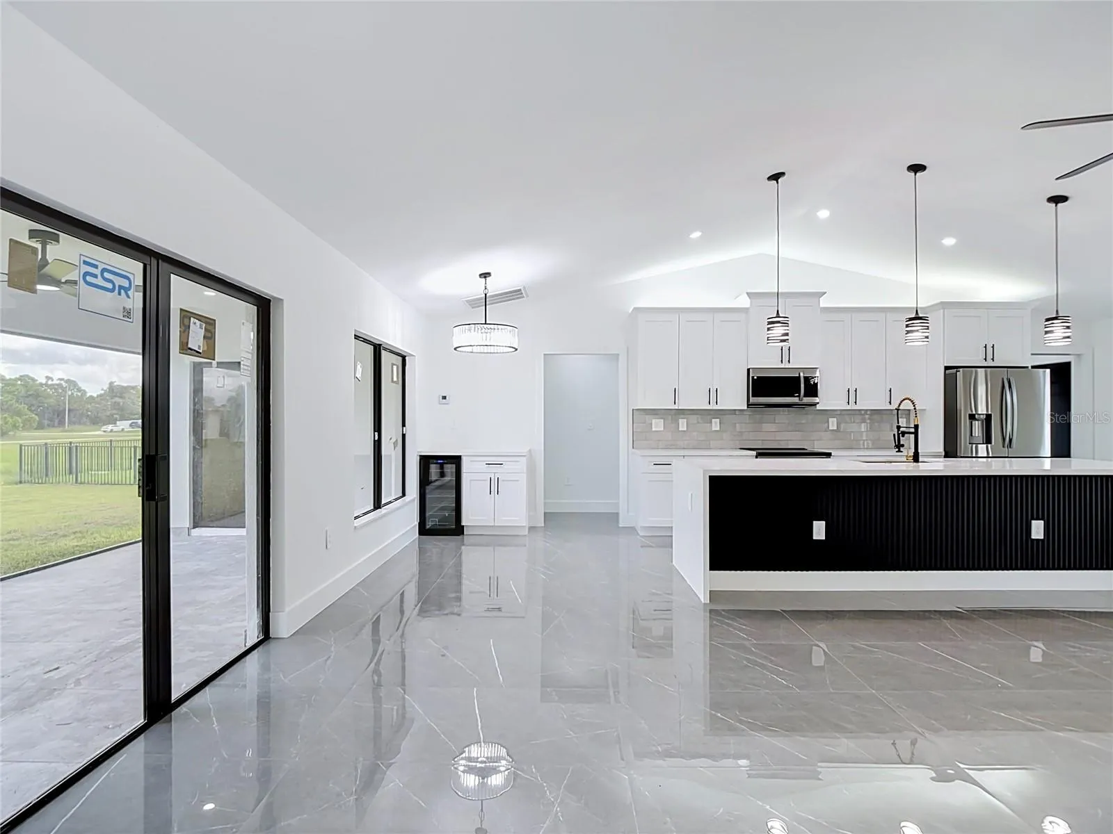 Another view of the dining area & kitchen