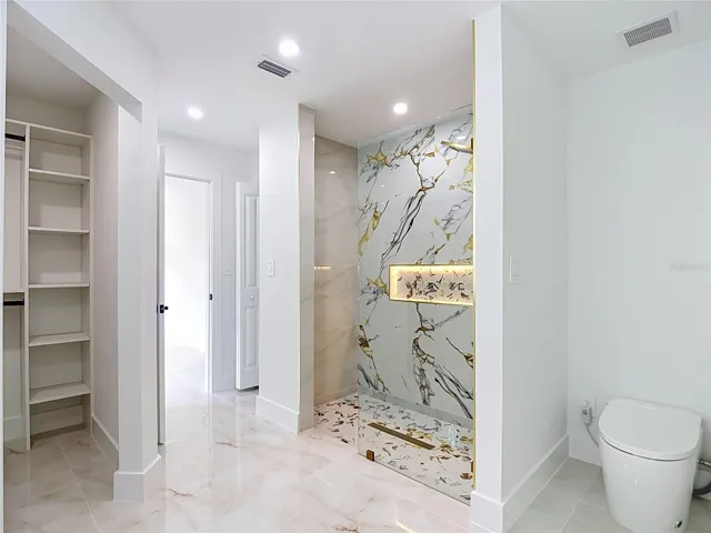 Primary bathroom with walk in closet, exceptional shower and smart toilet with bidet.