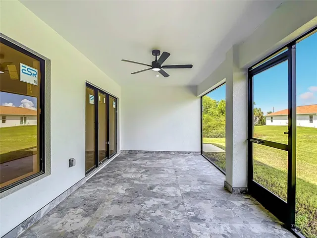 Screened lanai with ceramic tiling & overhead fan