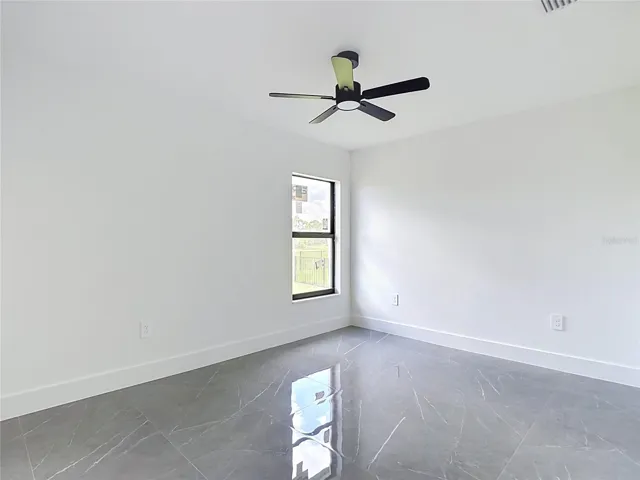 One of 4 bedrooms.  All bedrooms feature overhead fans