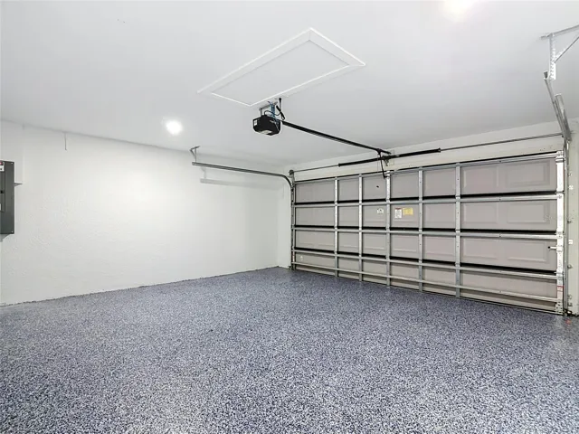 View of garage with finished flooring
