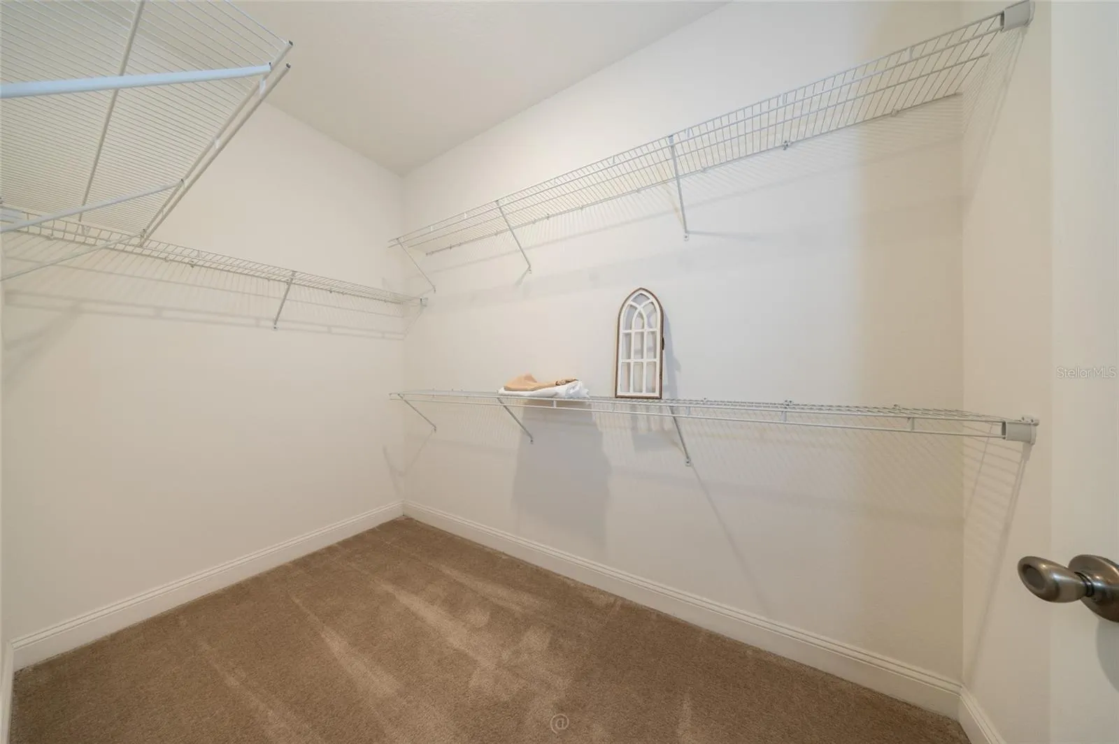 LARGE WALK-IN CLOSET IN THE PRIMARY BEDROOM