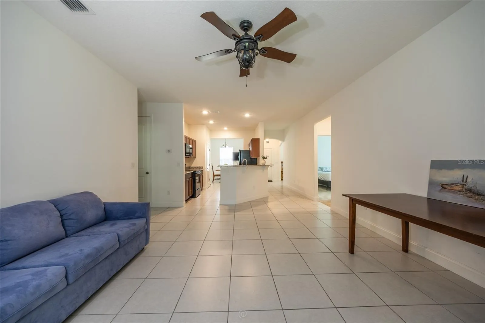 UNSTAGED LIVING ROOM. THIS FURNITURE CONVEYS