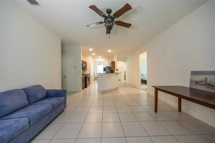 UNSTAGED LIVING ROOM. THIS FURNITURE CONVEYS