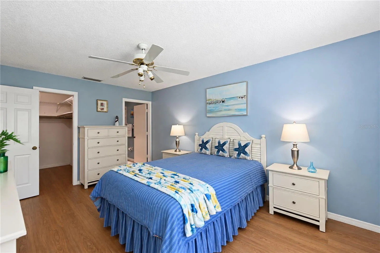 Primary bedroom to walk-in closet and ensuite bathroom