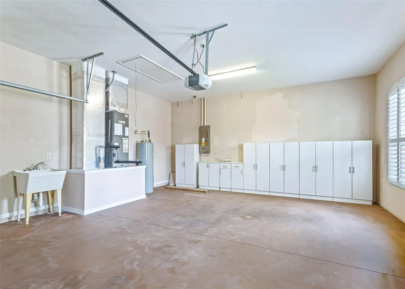 2 Car Garage w/Utility Sink & additional storage