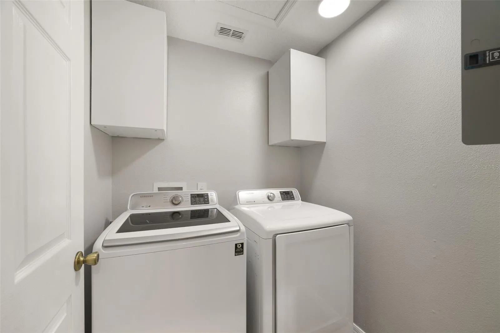 Just off the Kitchen, the dedicated Laundry Room offers additional cabinetry and includes the WASHER & DRYER for added convenience.