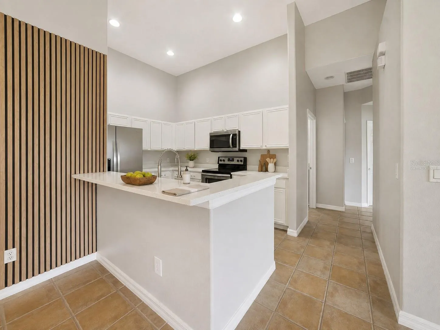 With room for counter-height stools, the breakfast bar doubles as a comfortable spot for quick meals or gathering with guests. Virtually Staged