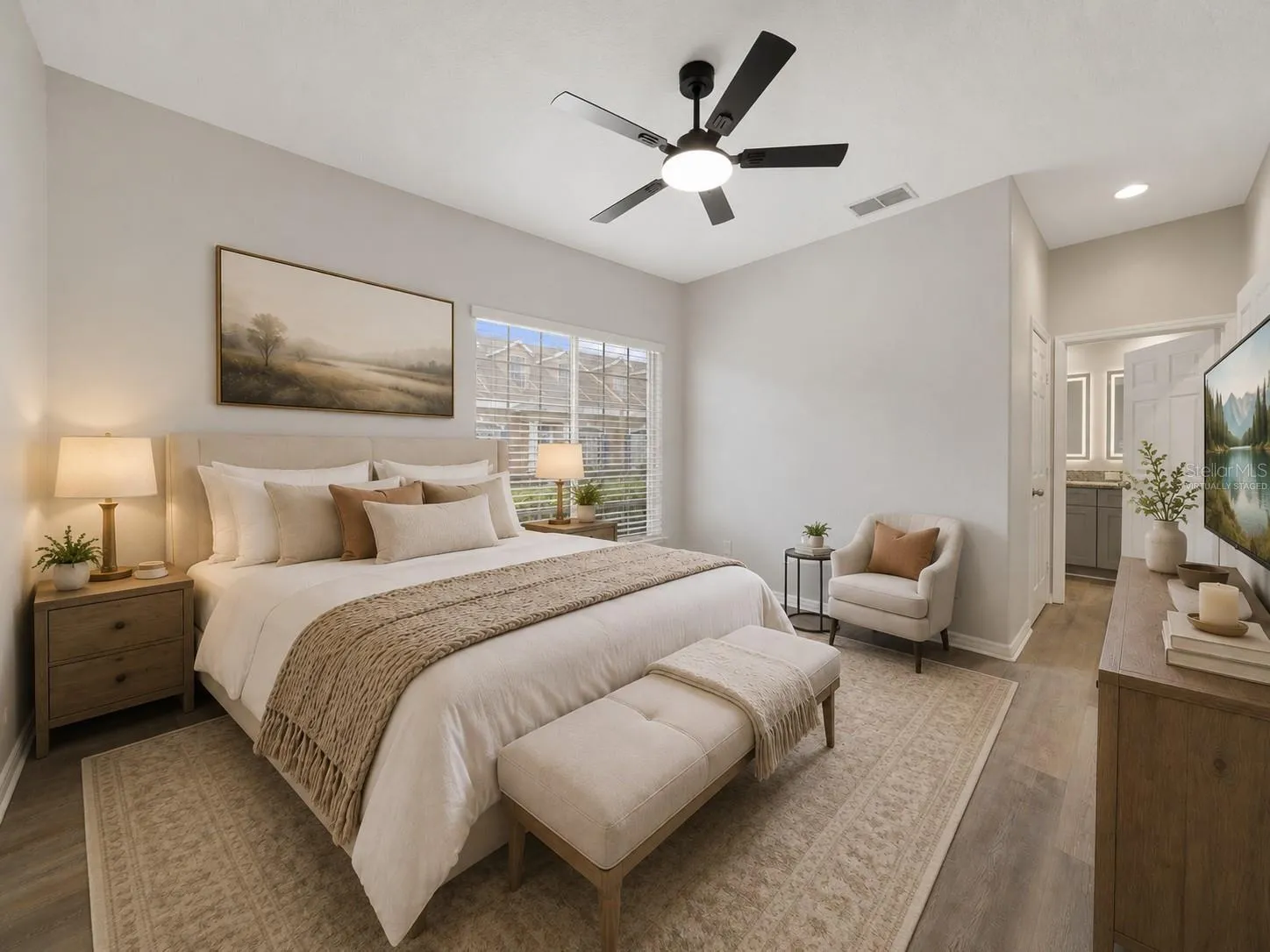 The spacious PRIMARY BEDROOM offers a WALK-IN CLOSET and private en-suite bath with DUAL SINKS and STEP-IN SHOWER. Virtually Staged.