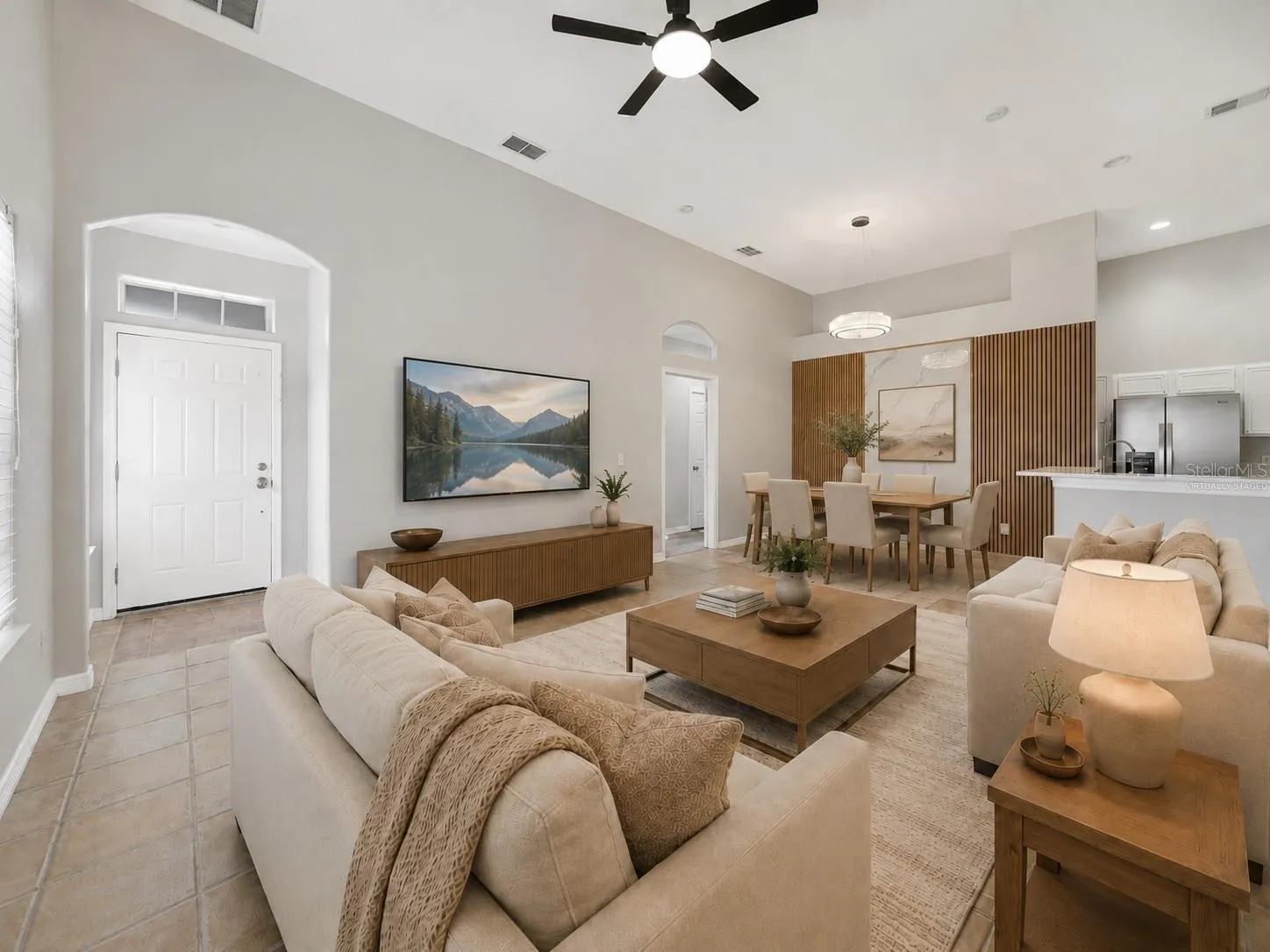 The Living Room boasts great natural light and sleek tile flooring for a fresh, airy feeling. Virtually Staged