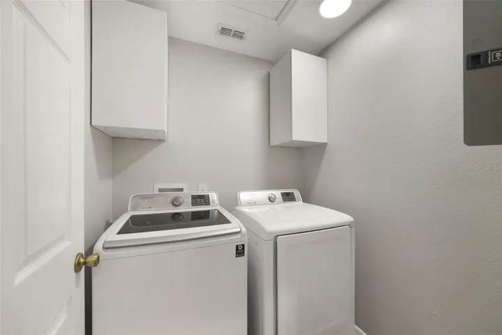 Just off the Kitchen, the dedicated Laundry Room offers additional cabinetry and includes the WASHER & DRYER for added convenience.