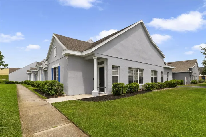 The home is positioned on a CORNER LOT with meticulously maintained landscaping, lush green lawn and a 2-CAR REAR-ENTRY GARAGE.