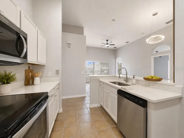 With room for counter-height stools, the breakfast bar doubles as a comfortable spot for quick meals or gathering with guests. Virtually Staged