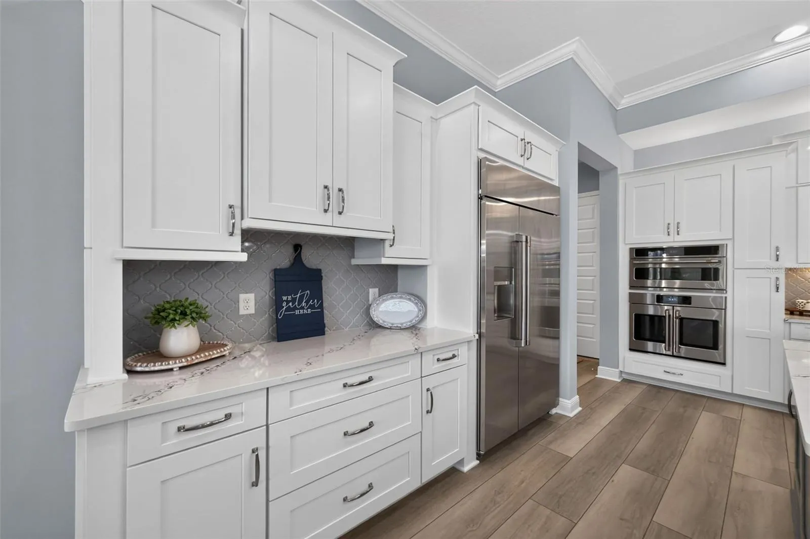 Another wall of kitchen cabinetry and countertop space!