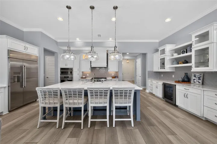 Breakfast Bar with pendant lighting offers a comfortable place for morning coffee.