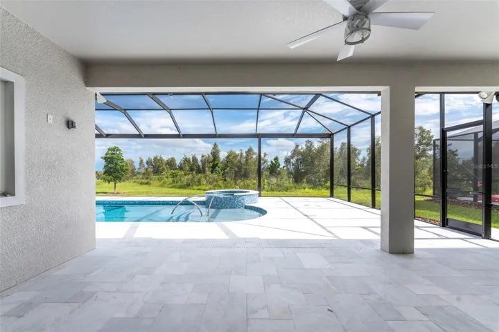 Gorgeous marble flooring in the lanai and on the pool deck