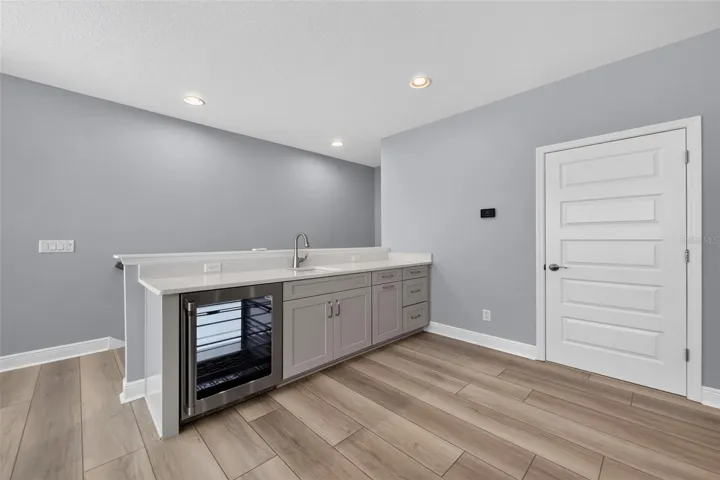 2nd FLOOR -Wet bar and beverage refrigerator in Media Room