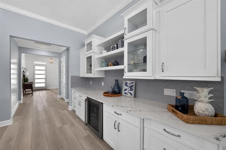 Some of the cabinetry are glass fronted.
