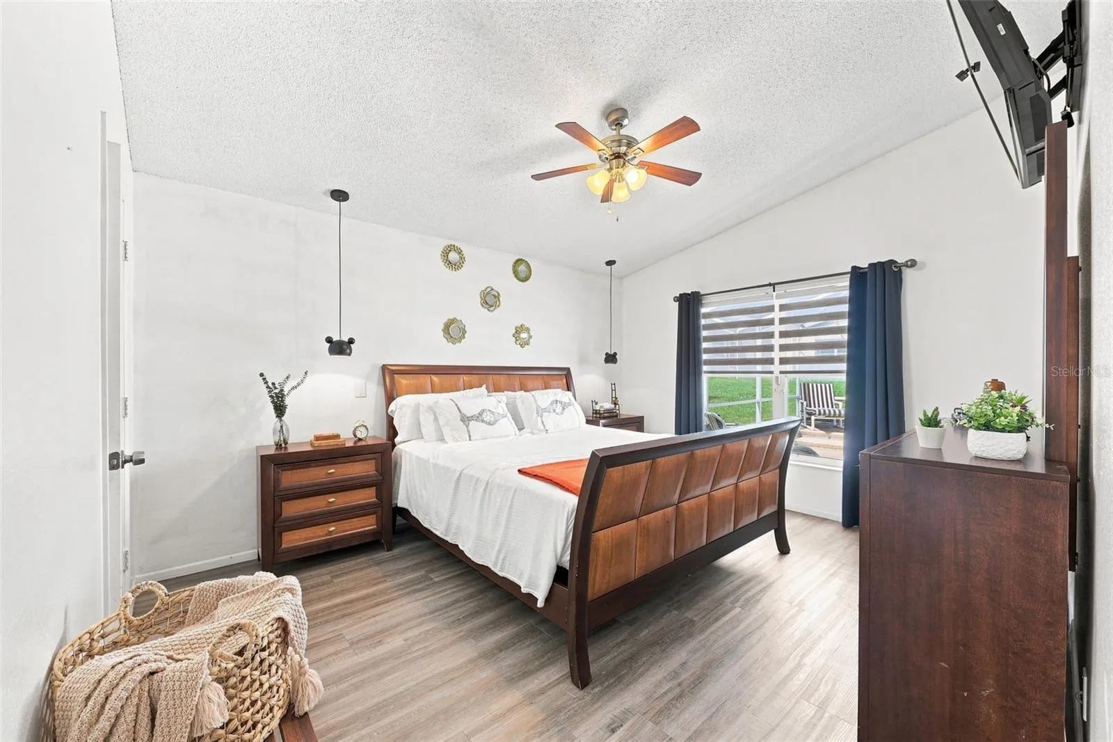 The spacious primary bedroom offers a peaceful retreat, complete with a private en suite featuring dual sinks and a generous walk-in closet.