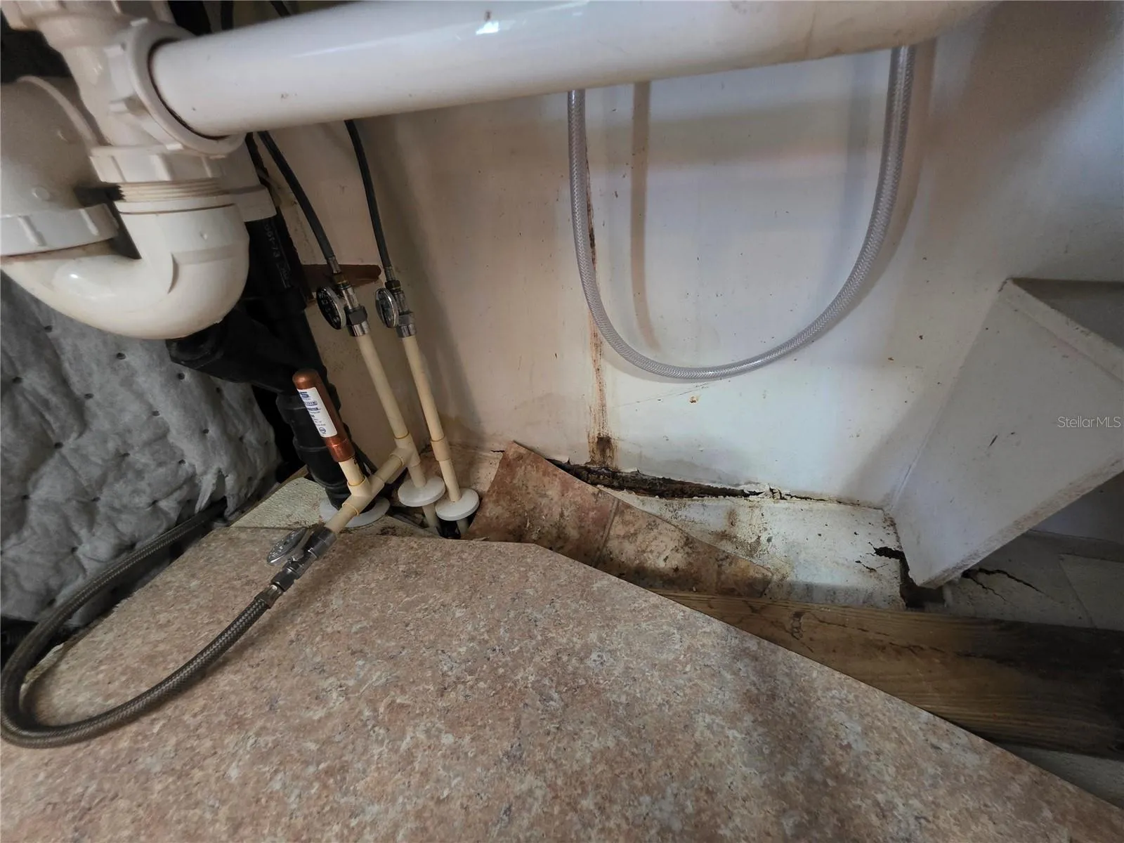 Damage under the kitchen sink