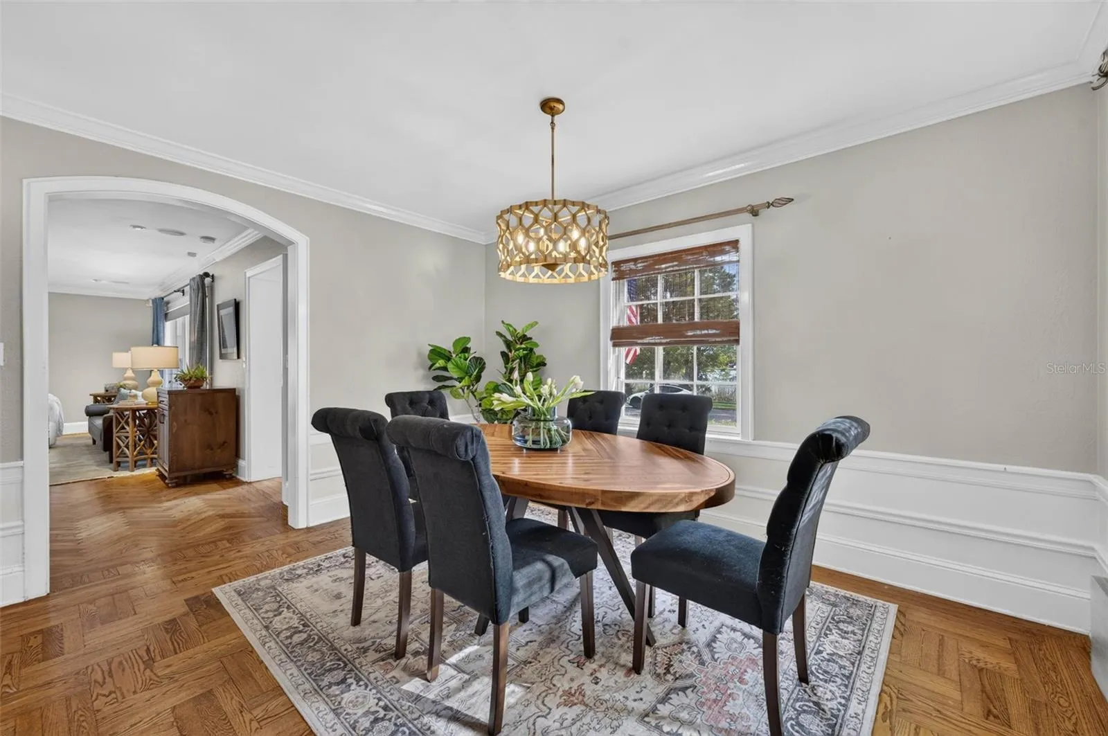 Dining Room with Arched Doorways and Large Windows