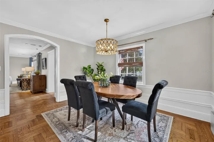 Dining Room with Arched Doorways and Large Windows