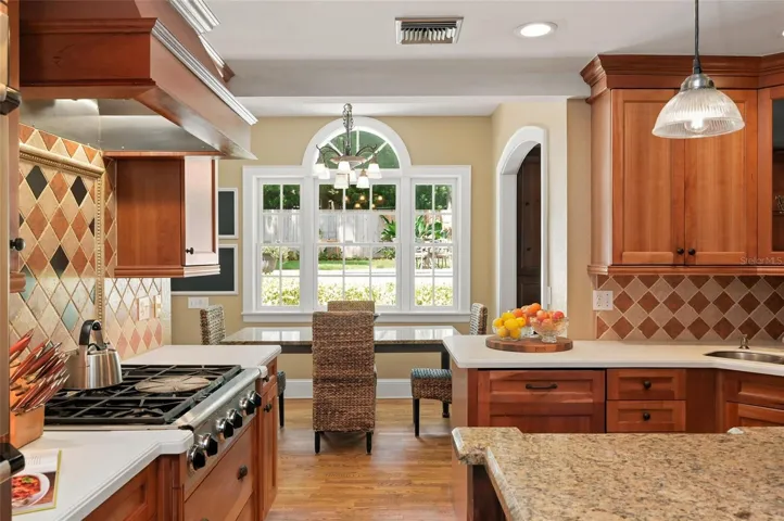Kitchen Connects to Casual Eat-in Area and Formal Dining Spaces