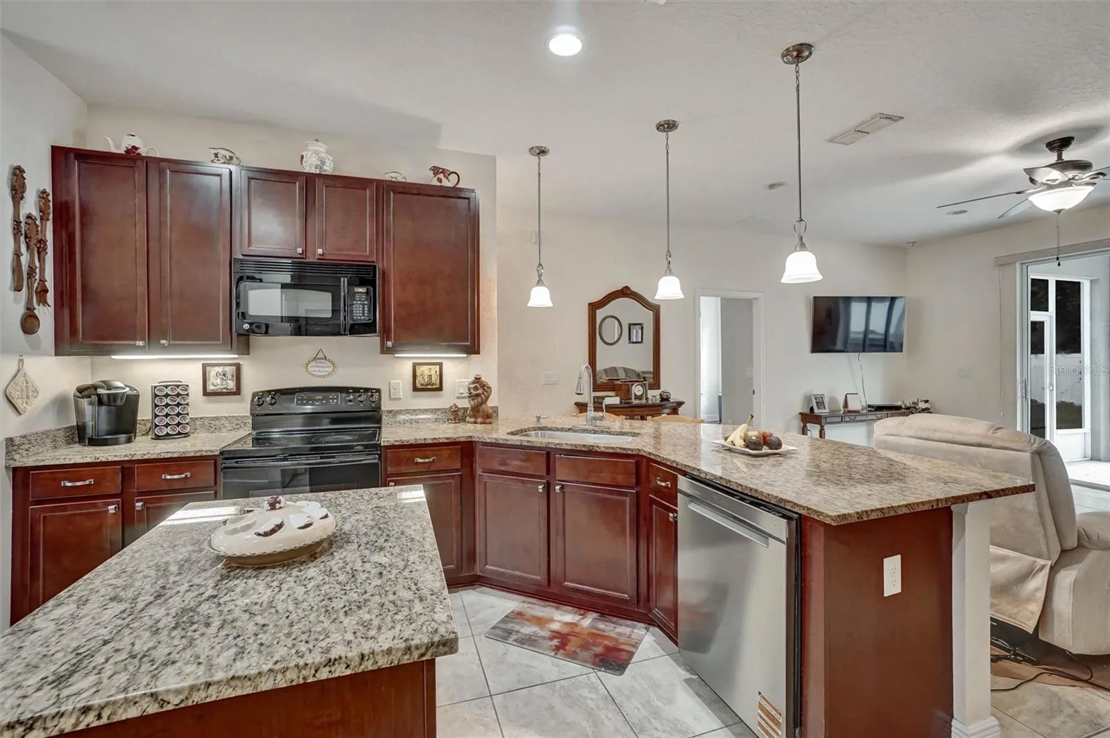 KitchenKitchen with ample cabinetry, granite countertops, and convenient storage.