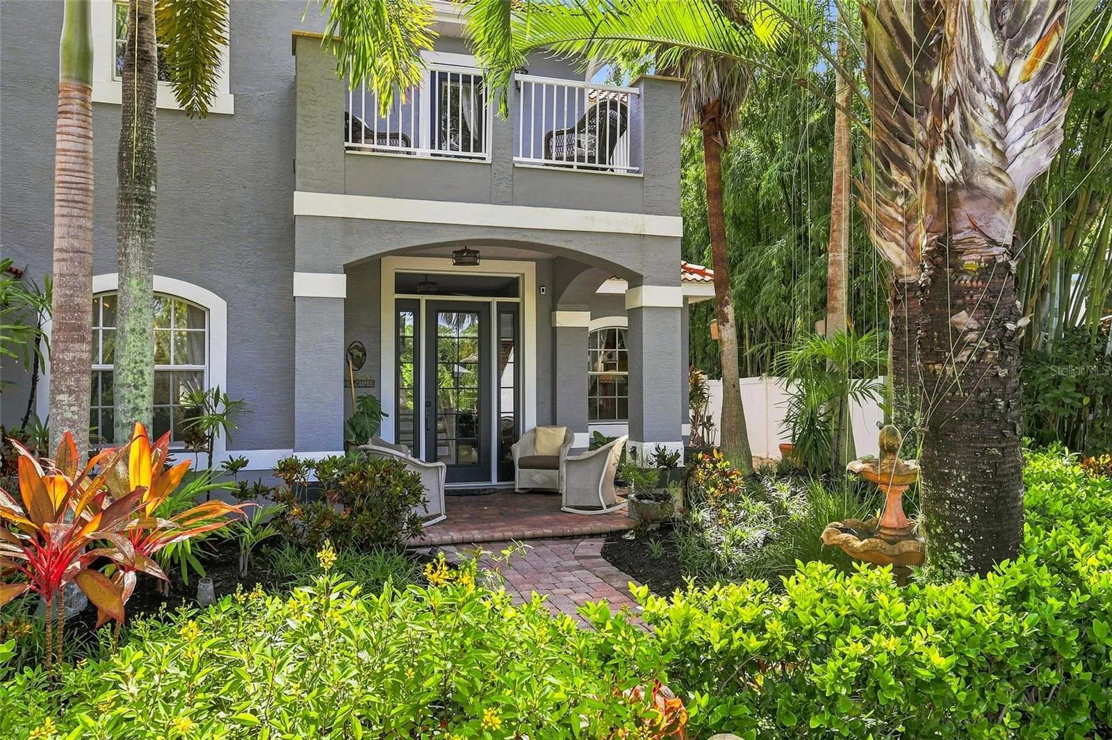 Inviting entry with mature landscaping