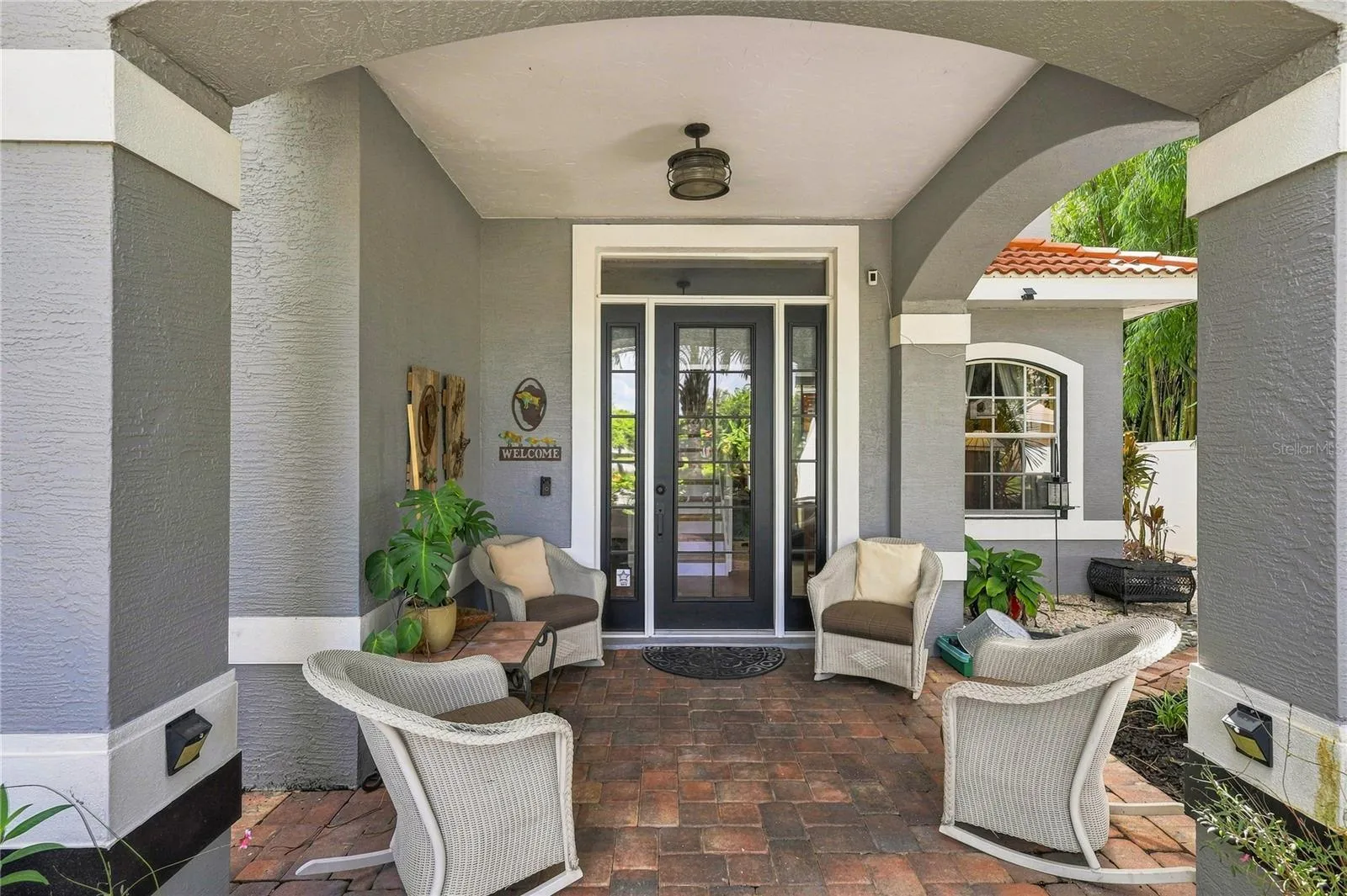 Covered front entry with a welcoming seating area