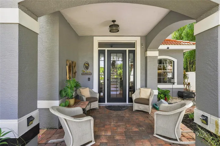 Covered front entry with a welcoming seating area