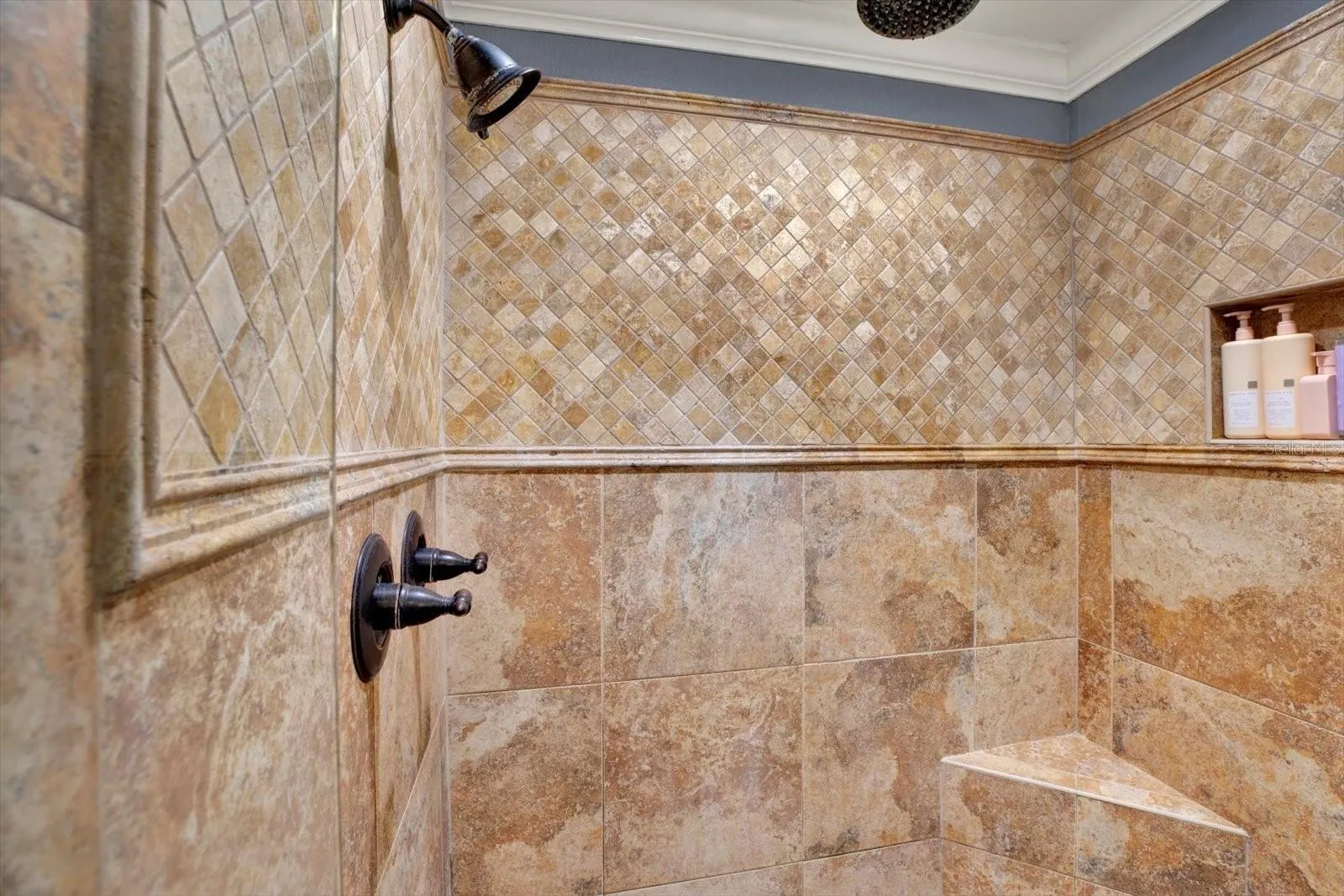 Detail of the primary bath's tiled walk-in shower.