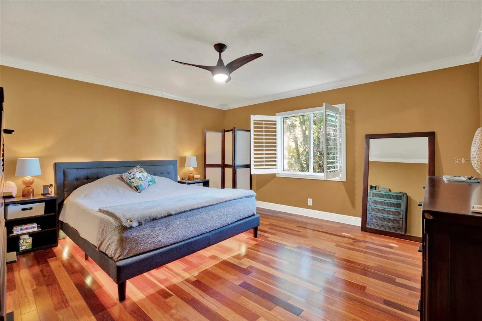 Spacious primary bedroom suite with walk in closet