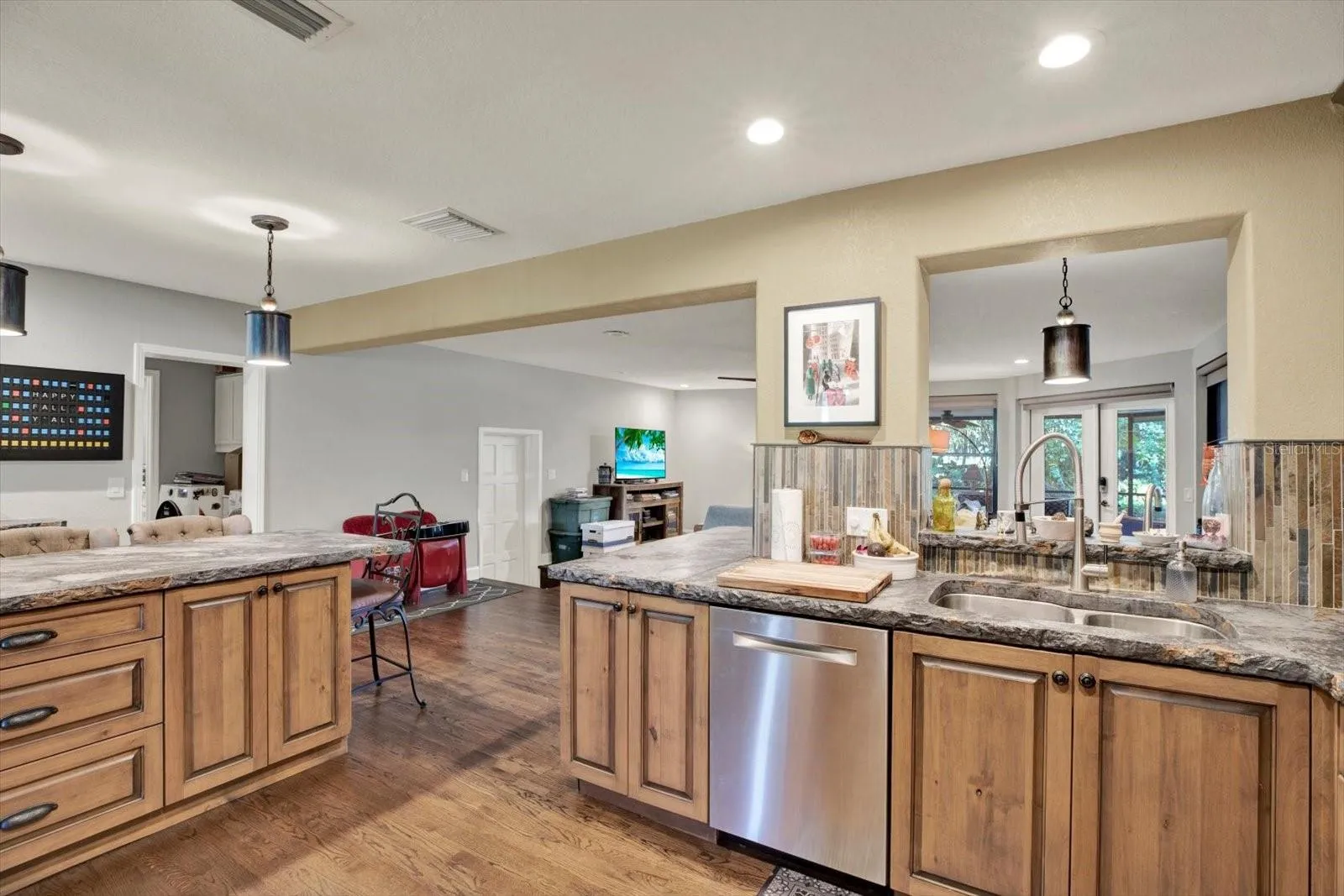 Kitchen island with concrete countertops and abundant prep space.