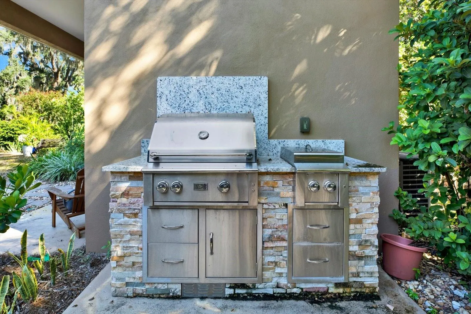 Built-in outdoor kitchen grill, ready for entertaining.
