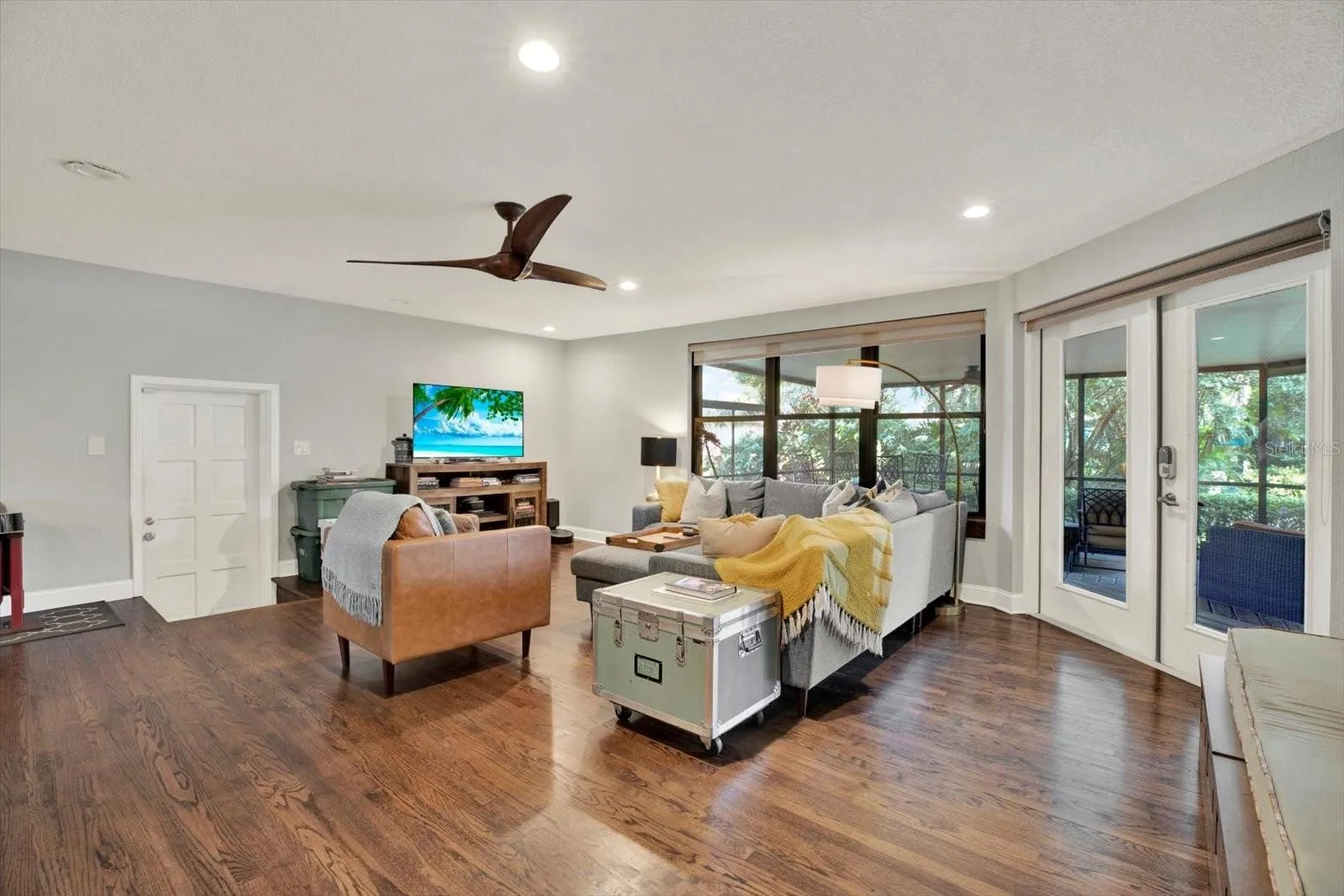 Family room with French doors leading out to the lanai.