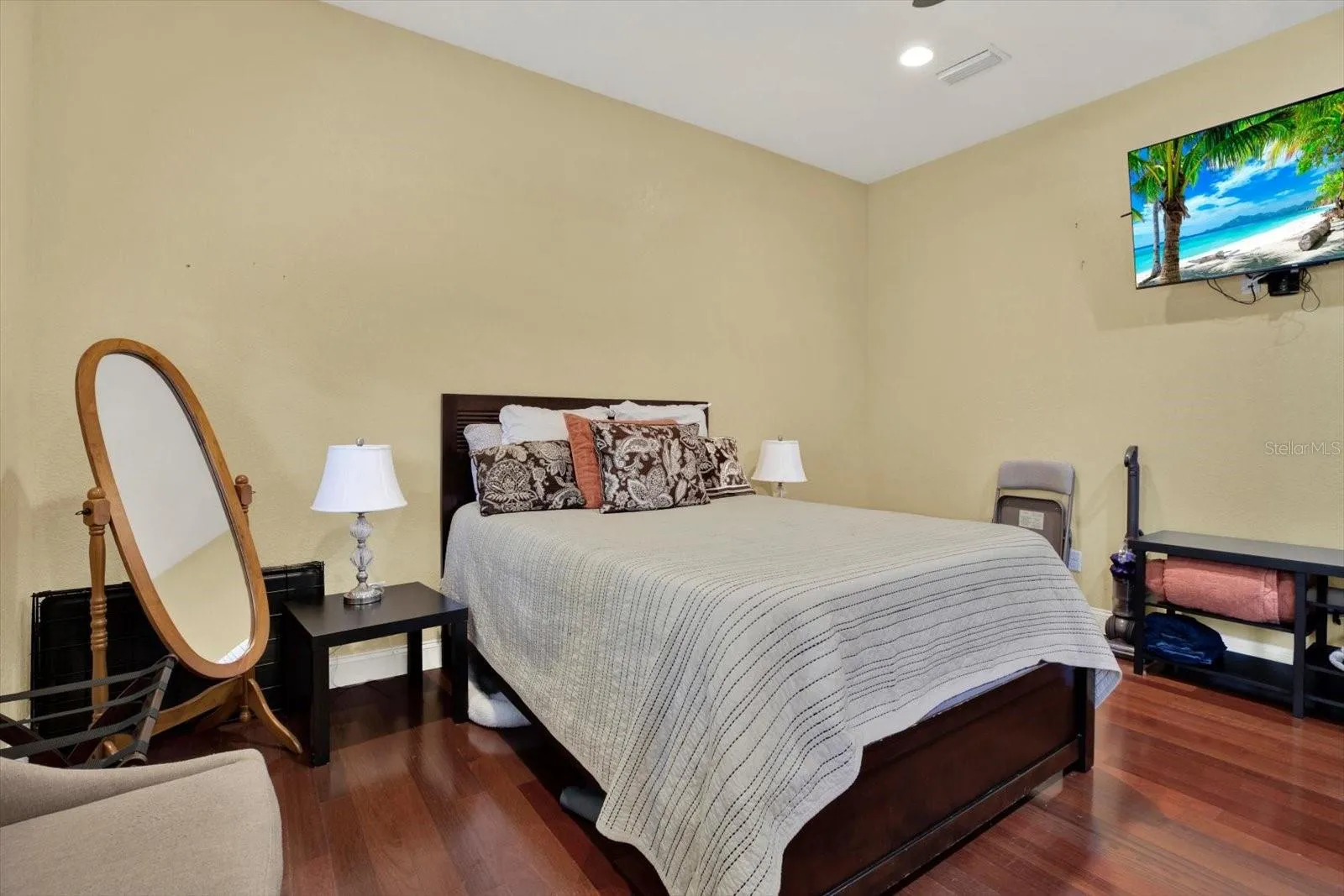 Casita / guest house bedroom with wood floors.