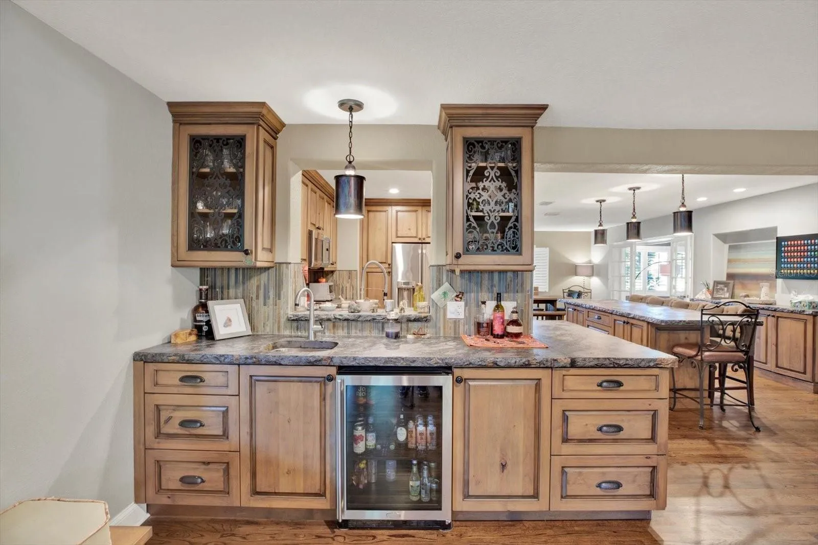 Wet bar detail featuring a refrigerator.