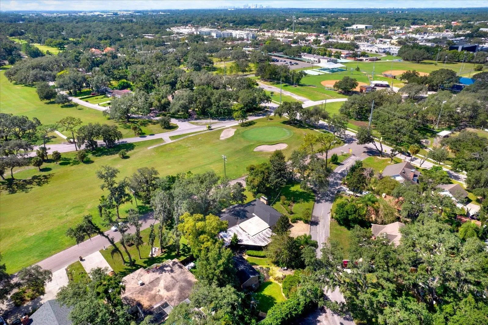 Aerial view showing the home's frontage on the historic Temple Terrace Golf Course.