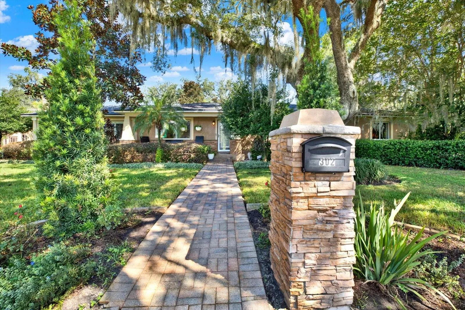Paver walkway leading to the covered front entry of 302 Belle Terre Ave, Temple Terrace