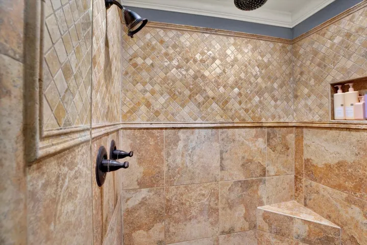 Detail of the primary bath's tiled walk-in shower.