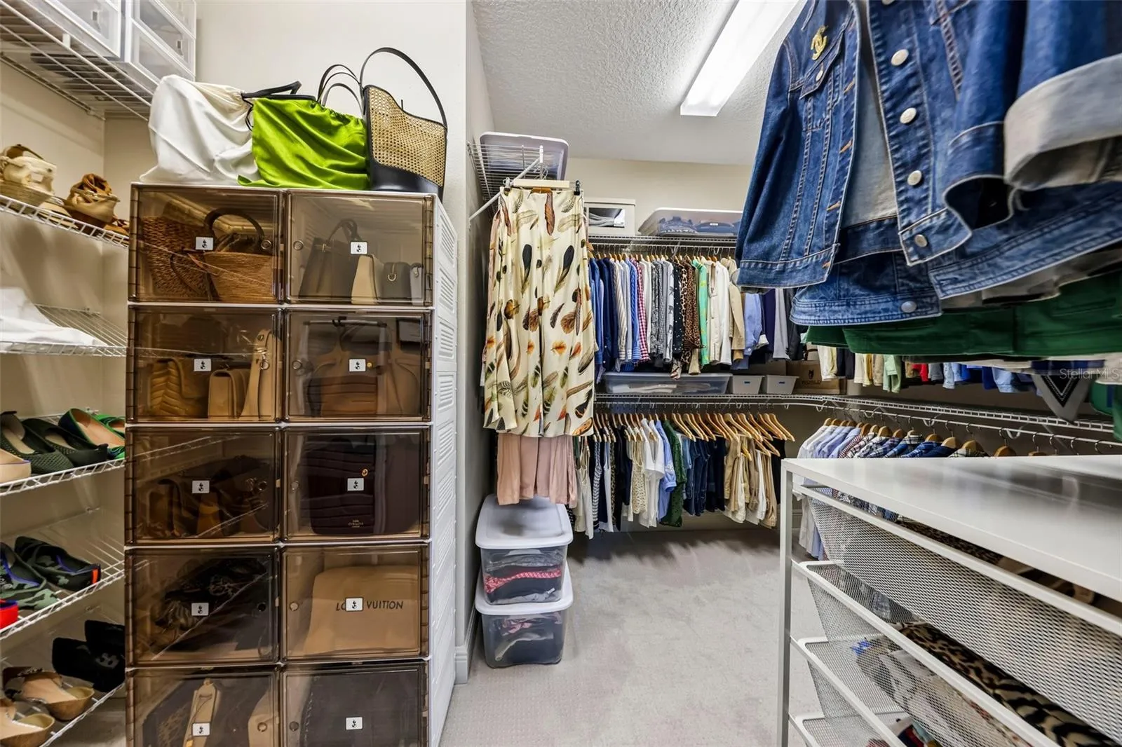 Walk-In Closet between Primary Bedroom and Primary Bathroom