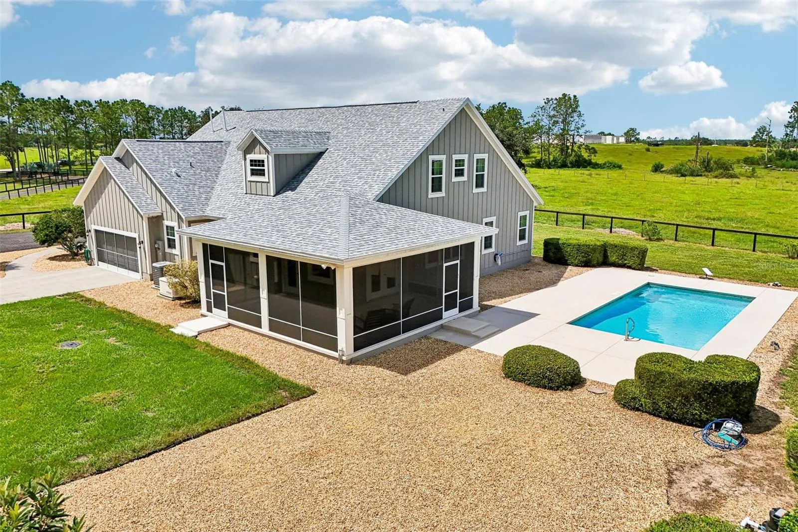 Rear/Side Exterior with Lanai & Pool Area